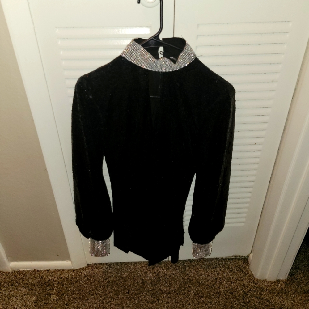 Shimmering black blouse with blinged out neck collar and wrists